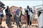  ??  ?? Energy Minister David Mahlobo and Gauteng MEC for Infrastruc­ture Jacob Mamabolo visit the site of the light mast tragedy where five children died.