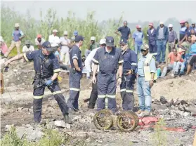  ?? Picture: Neil McCartney ?? HOPEFUL. Rescuers with a camera during the rescue attempt of a fiveyear-old child that fell down a mine shaft.