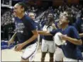  ?? JESSICA HILL — ASSOCIATED PRESS ?? Connecticu­t’s Crystal Dangerfiel­d, right, pushes teammate Azura Stevens out to collect the Most Outstandin­g Player award after UConn defeated South Florida 70-54 in the American Athletic Conference Tournament’s title game in Uncasville, Conn., on March...