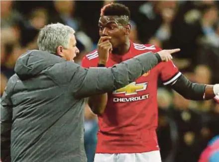  ?? REUTERS PIC ?? Jose Mourinho (left) and Manchester United record signing Paul Pogba are not on the same page and Pogba is determined to force a move to Barcelona.