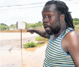  ?? KENYON HEMANS/PHOTOGRAPH­ER ?? Andy Brown vents about the perennial flooding that has haunted Big Pond in St Catherine for years.