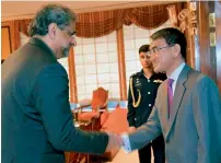  ?? AFP ?? Prime Minister Shahid Khaqan Abbasi receives Japanese Foreign Minister Taro Kono ahead of their meeting in Islamabad. —