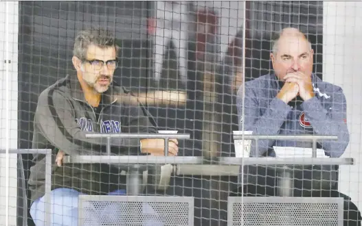  ?? JOHN MAHONEY FILES ?? Montreal Canadiens general manager Marc Bergevin, left, watches a training camp practice with his assistant Larry Carrière in Brossard in 2018.