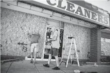  ?? Joe Raedle / Getty Images ?? Hurricane Florence threatens to slow regional businesses to a crawl, and those could take time to recover.