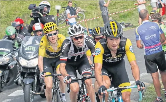  ??  ?? Primoz Roglic, right, on his way to winning the 19th stage ahead of Tom Dumoulin, second left, and Geraint Thomas, left.