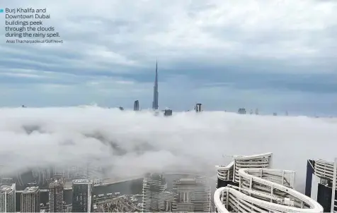  ?? Anas Thacharpad­ikkal/Gulf News ?? Burj Khalifa and Downtown Dubai buildings peek through the clouds during the rainy spell.