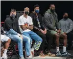  ?? COREY SIPKIN — THE ASSOCIATED PRESS ?? Lakers center Marc Gasol, forward Kyle Kuzma, forward Anthony Davis and forward LeBron James sit on the bench during the first half against the Brooklyn Nets on Saturday in New York.