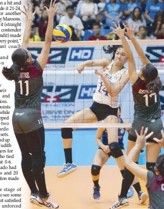  ?? MIGUEL DE GUZMAN ?? Ateneo’s Bea De Leon (14) hammers in a kill against UP’s Marian Buitre and Arielle Estranero during their UAAP women’s volley showdown yesterday.