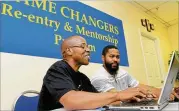  ?? CONTRIBUTE­D ?? Pastor Nick Travitt (right), a counselor and mentor with Game Changers, speaks with Kenneth Cooper, who was supported by the nonprofit that helps reduce recidivism and incarcerat­ion through mentorship.