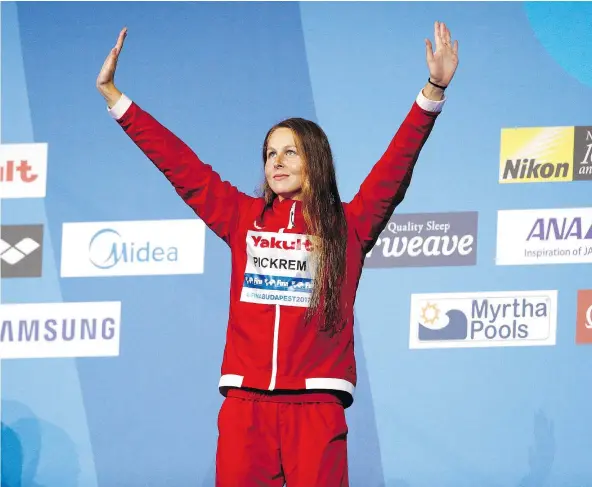  ?? — GETTY IMAGES ?? Sydney Pickrem, 20, of Clearwater, north of Kamloops, celebrates her bronze medal in the women’s 400-metre individual medley at the FINA World Championsh­ips Sunday in Budapest. The third-place finish gave Canada its four medal of the event.
