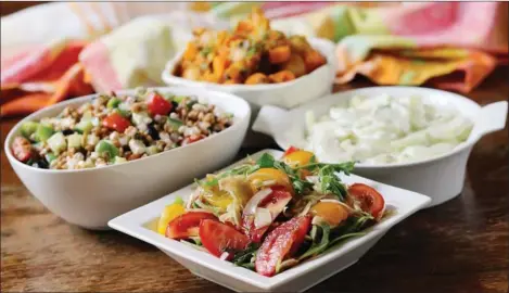  ?? ADRIAN LAM, TIMES COLONIST ?? This colourful array of salads features vegetables available at farmers’ markets around Victoria. Clockwise from bottom: Fennel and tomato salad with salad greens; Greek-style lentil salad; Moroccan-spiced potato and carrot salad with zucchini; and...