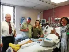  ?? SUBMITTED PHOTO ?? Joaquin Ayllon Cordova lies in his hospital bed as he is cheered by well-wishers after gaining his long dream of U.S. citizenshi­p. From left are James Graham, Mario Ayllon, Celina Ayllon, Joaquin, and Elaine Girod Marnell.