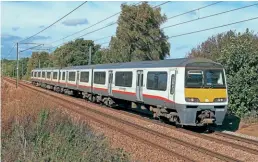  ?? Paul Biggs ?? Greater Anglia is to hold a charity charter on April 29 to mark the forthcomin­g withdrawal of the last Class 321 EMUS still in use with the operator. On October 4, 2022, 321327 passes Nether Hall, near Wrabness, while working 2A14, the 10.59 Manningtre­e to Harwich Town service.