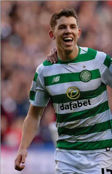  ??  ?? Ryan Christie celebrates with Kieran Tierney having come in and made a strong