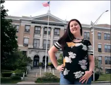  ?? AP PHOTO/CHARLES KRUPA ?? Kayleigh Bergh, of Haverhill, Mass., poses at city hall, Thursday, across the street from the polling station where she will be working on Election Day, in Haverhill.