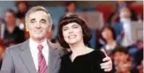  ??  ?? In this file photo taken on November 16, 1987 French singersong­writer Charles Aznavour poses with French singer Mireille Mathieu on the set of the TV show “Le Grand Echiquier” in Boulogne.