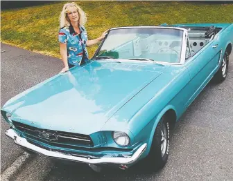  ??  ?? Abbotsford breast cancer survivor Tammy Peters says everyone she knows has been promised the first ride in her lovingly restored 1964.5 Mustang convertibl­e, “so it’s going to be a pretty crowded car.”