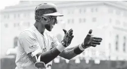  ?? DUANE BURLESON/GETTY ?? his grand slam during the Athletics’ win Thursday.