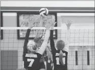  ?? RICK PECK/SPECIAL TO MCDONALD COUNTY PRESS ?? McDonald County’s Shye Hardin hits a spike against the block of Diamond’s Hadyn Russow (7) and Savannah Divine (11) during the Lady Wildcats 19-25, 25-22, 19-17 win in pool play of the Lady Mustang Volleyball Classic held on Oct. 19 at MCHS.