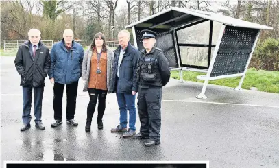  ??  ?? ● Above, Councillor Alun Mummery (Portfolio Holder for Community Safety), and local county councillor­s Bob Parry, Nicola Roberts and Dylan Rees, with PCSO Carwyn Gilford outside the Llangefni youth shelter which has suffered as a result of anti-social behaviour and, left, a Boxing Day fire at a former primary school building in Llangefni