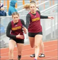  ?? JOHN BREWER - ONEIDA DAILY DISPATCH ?? Canastota junior McKenzie Mitchell hands off the baton at the Oneida Invitation­al Saturday, May 12.