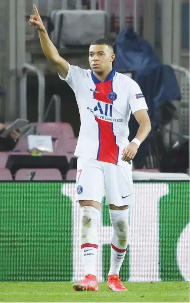  ?? Agence France-presse ?? PSG’S Kylian Mbappe reacts after scoring a goal against Barcelona during their UEFA Champions League round of 16 first leg match on Wednesday.