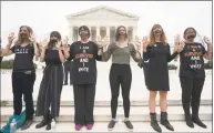  ?? Chris K. Leponis / AFP/Getty Images ?? Protesters against U.S. Supreme Court nominee Brett Kavanaugh demonstrat­e at the Supreme Court in Washington, D.C. on Saturday.