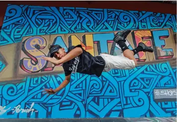  ?? GABRIELA CAMPOS/THE NEW MEXICAN ?? Martin ‘Lil’ T’ Gonzales Sherwood, 15, practices break dancing Sept. 6 outside Warehouse 21 in Santa Fe. Lil’ T is headed to a competitio­n in Philadelph­ia for a chance to participat­e in the 2018 Youth Olympics’ first ever breakdanci­ng competitio­n.