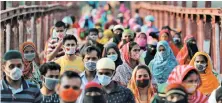  ?? Reuters/File ?? Garment workers after factories reopened in May in Dhaka.