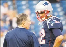  ?? Jim Rogash / Getty Images ?? Bill Belichick, Tom Brady and the Patriots will face the Titans on Saturday in the divisional round of the playoffs.