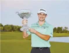  ??  ?? Patrick Cantlay poses with the winner’s trophy after winning the Shriners Hospitals For Children Open at the TPC Summerlin on November 5, 2017 in Las Vegas, Nevada. - AFP photo