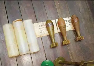  ?? SUPPLIED ?? Three 82mm mortar rounds were seized after Thai authoritie­s busted five alleged smugglers carrying the ordnance from Cambodia.