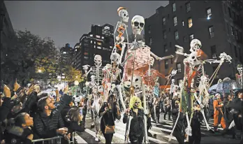  ?? FRANK FRANKLIN II/AP ?? Revelers march last year during the Greenwich Village Halloween Parade in New York.