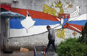  ?? ?? Graffiti of Serbian and Russian flags in a Serb-dominated part of Mitrovica, Kosovo