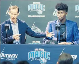  ?? STEPHEN M. DOWELL/STAFF PHOTOGRAPH­ER ?? Orlando Magic President of Basketball Operations Jeff Weltman, left, talks about what new draft pick Jonathan Isaac, right, brings to the team at Amway Center on Friday.