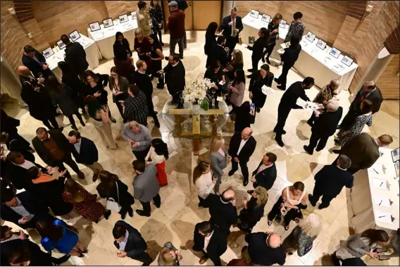  ?? PHOTOS BY ANDY CROSS — THE DENVER POST ?? Hors d’oeuvres are served before a large dinner service at the University of Denver’s Joy Burns Center on Thursday. The Fritz Knoebel School of Hospitalit­y Management program hosted refugees in a five- week food training course called the Ready for American Hospitalit­y program, which culminated Thursday evening with a large meal at the center.