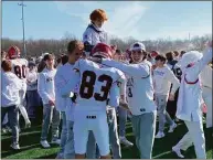  ?? Scott Ericson / Hearst Connecticu­t Media ?? New Canaan celebrates with fans after winning the 2022 Turkey Bowl.