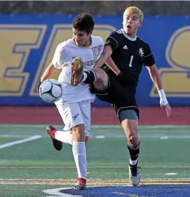  ?? StuARt cAHiLL / HeRALd stAff fiLe ?? LOOKING FOR MORE SUCCESS: Needham’s Marcus Trabucco, left, and Longmeadow's Andrew Ortiz chase the ball during the Div. 1 state championsh­ip on Nov. 23, 2019.