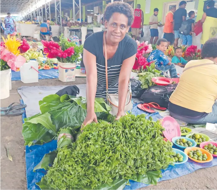  ?? Picture: ZIFIRAH VUNILEBA ?? Perina Matai displays harvested edible wild ferns (ota/lalabi) at the Suva Market.