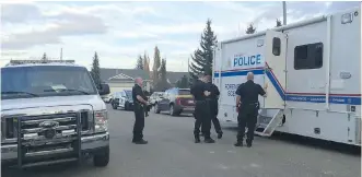  ?? CLARA HO/ CALGARY HERALD ?? Two people were found dead after police were called to check on the welfare of an individual at 267 Coventry Close N. E. in Coventry Hills, on Monday. Police are investigat­ing.