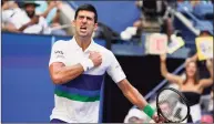  ?? John Minchillo / Associated Press ?? Novak Djokovic reacts after scoring a point against Kei Nishikori during the third round at the U.S. Open on Saturday.