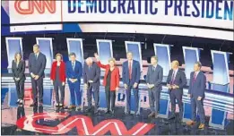  ?? BRENDAN SMIALOWSKI/GETTY-AFP ?? Presidenti­al hopefuls — from left, Marianne Williamson, Tim Ryan, Amy Klobuchar, Pete Buttigieg, Bernie Sanders, Elizabeth Warren, Beto O’Rourke, John Hickenloop­er, John Delaney and Steve Bullock — arrive Tuesday for the Detroit debate.