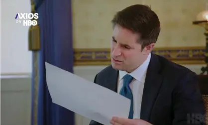  ?? Photograph: HBO ?? Jonathan Swan puzzles over papers in his interview with Trump.