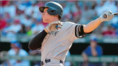  ?? LM OTERO/AP PHOTO ?? Aaron Judge watches one of his two home runs leave the park, his 40th and 41st of the season, during the Yankees’ 16-7 victory over the Texas Rangers on Sunday in Arlington.