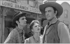  ?? COURTESY CBS ?? Weaver, left, starred as Chester, along with Amanda Blake as Kitty and James Arness as Marshal Matt Dillon in ‘Gunsmoke,’ a CBS western series that ran from 1955 to 1975.