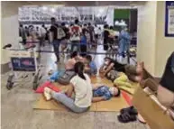  ?? ?? Passengers stranded at the Sanya Fenghuang Internatio­nal Airport on Saturday. — Cai Jin