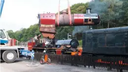  ?? STEPHEN MAHER ?? The boiler of Ivatt ‘2MT’ No. 46441 being lifted from the frames at Haverthwai­te on July 17 for transport to a contractor, with Hunslet ‘Austerity’ 0-6-0ST Works No. 3696 Repulse in the background.