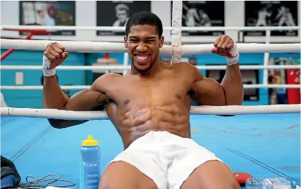  ?? PHOTO: GETTY IMAGES ?? Anthony Joshua shows off his torso as he fronts the media in Sheffield ahead of his fight with Joseph Parker.