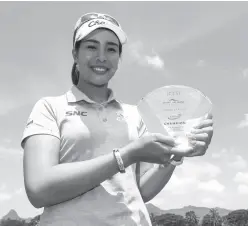  ??  ?? NEMITTRA Juntanaket holds her trophy after snapping a two-year title drought on the Ladies PGT