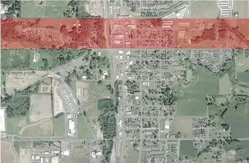  ??  ?? A satellite image shows Sumas, Wash., which is close to the Canadian border near Abbotsford, B.C. The area highlighte­d in red should have been granted to Canada but wasn’t due to a surveyor’s error.